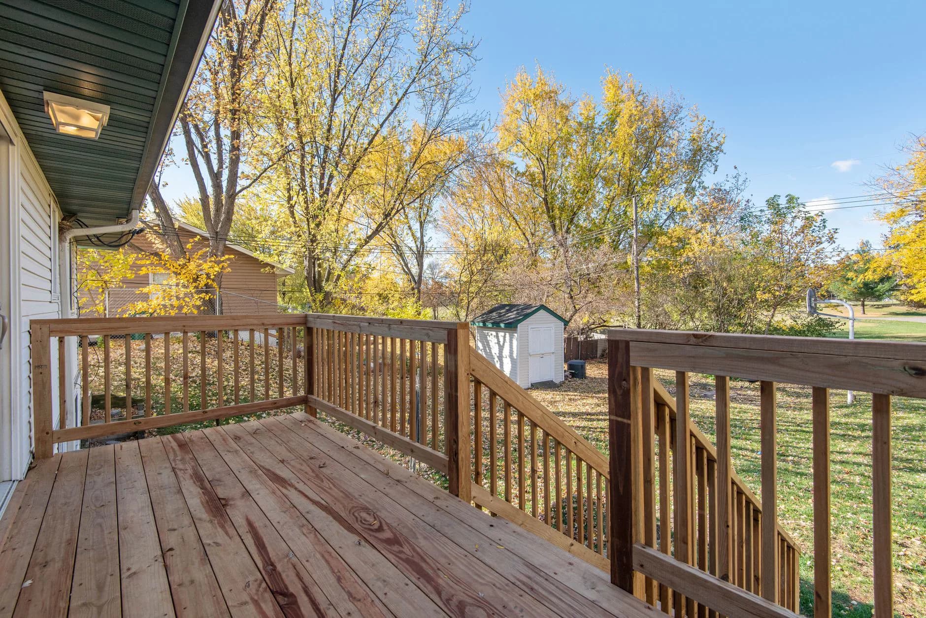 A deck under construction, its joists and framing visible before the boards go down
