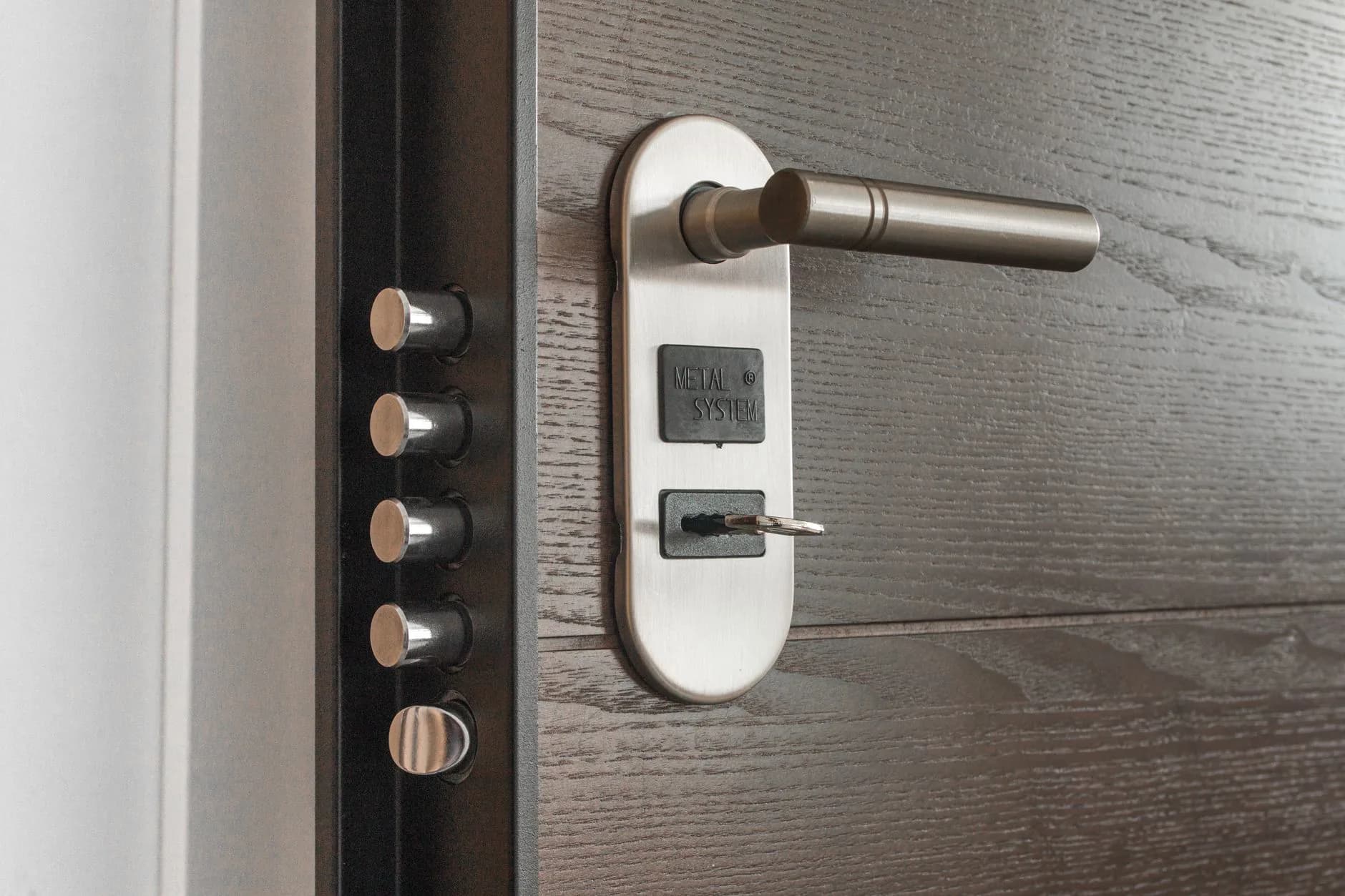 A deadbolt and handle on a front door