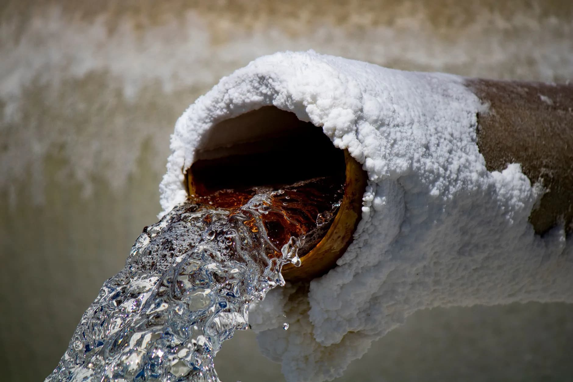 Water running from a corroded pipe