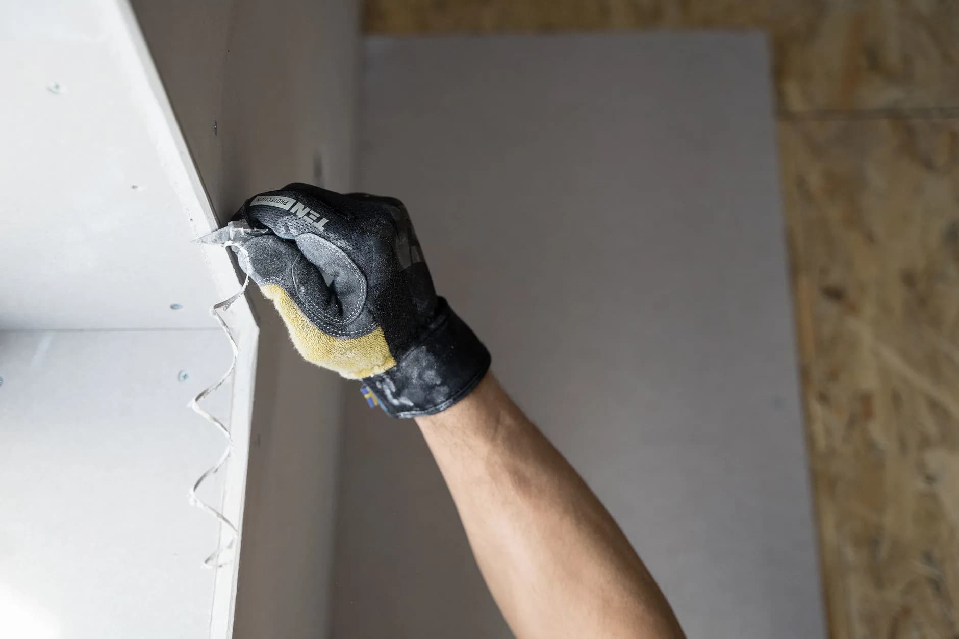 A drywall patch being finished