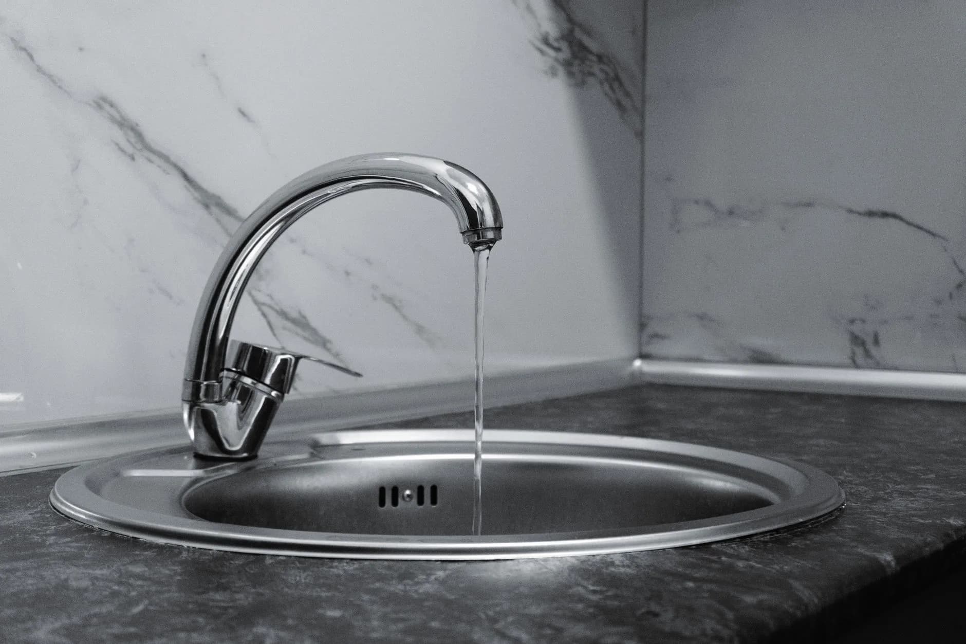 Water draining slowly from a kitchen sink
