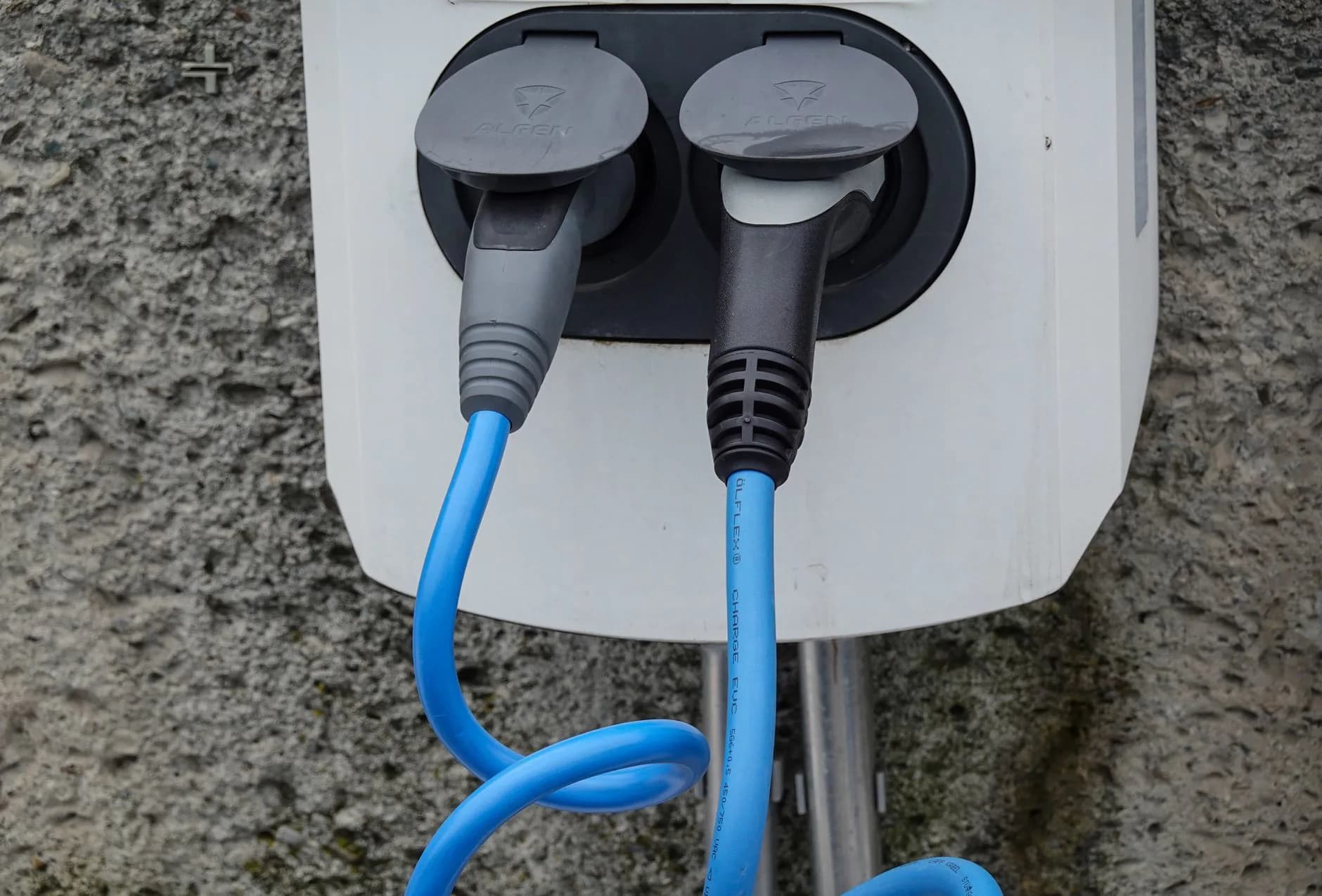 A charging cable plugged into an electric car