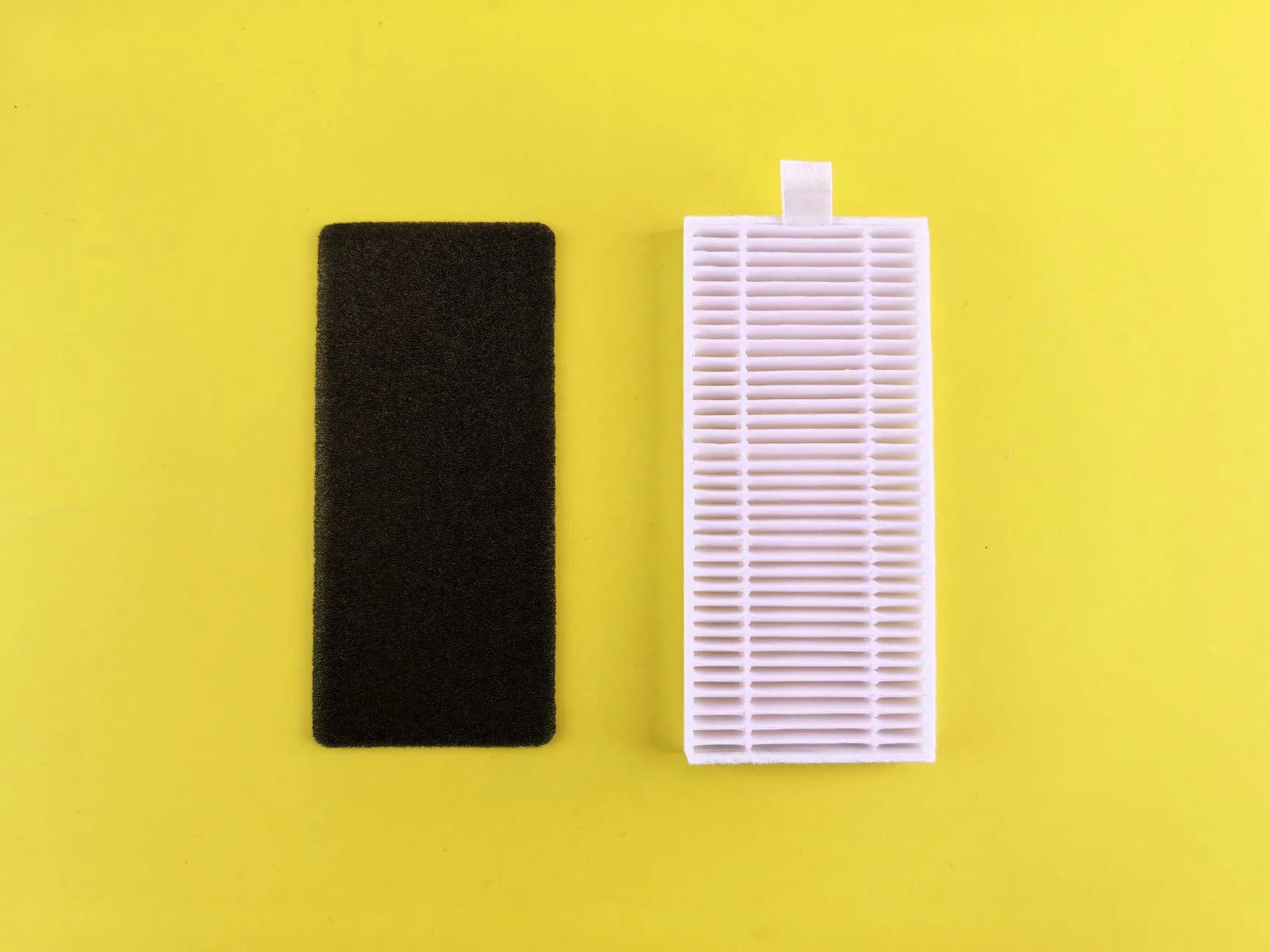 A clean and a dirty air filter side by side