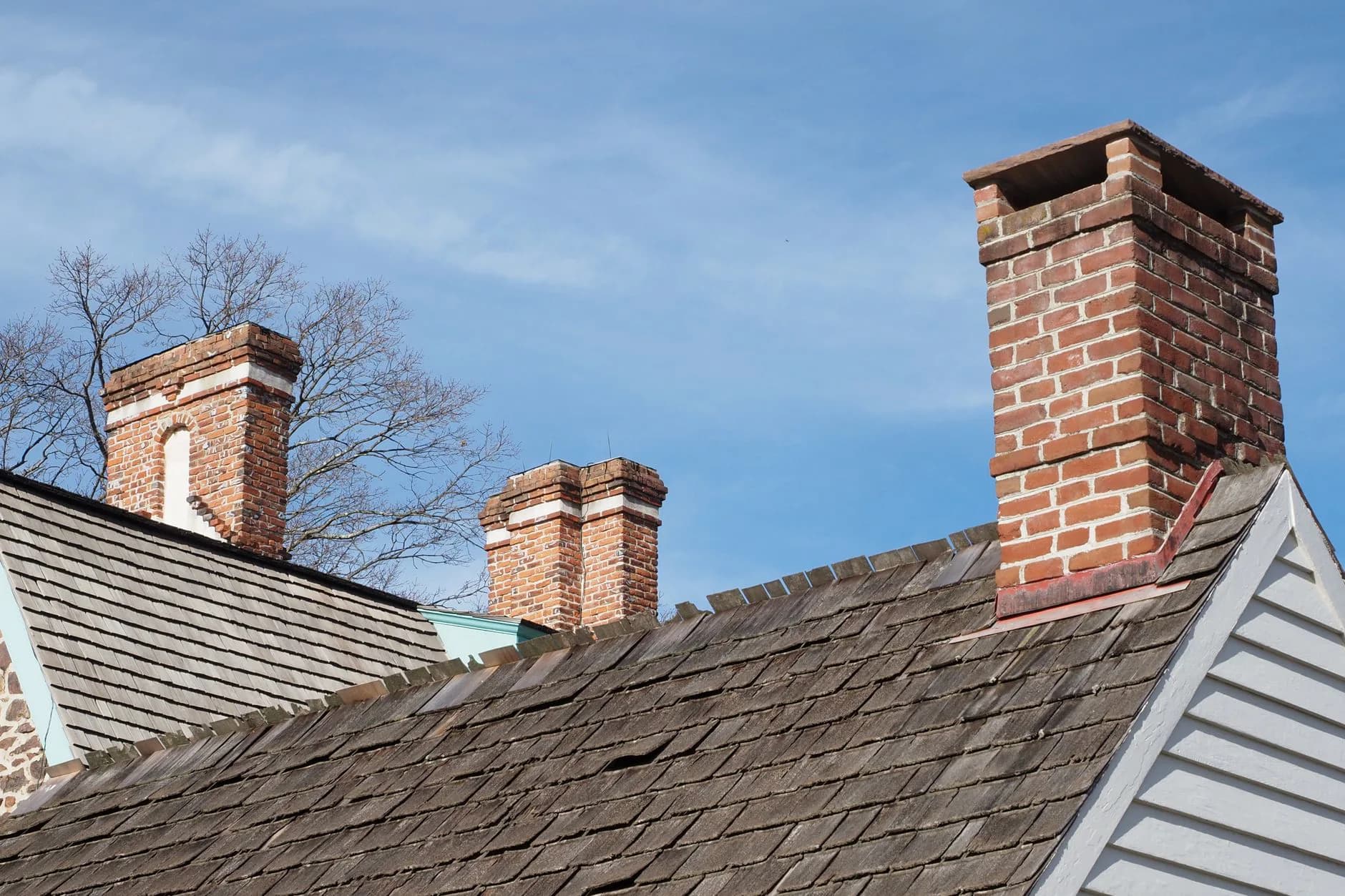 Brick chimneys on a residential roof