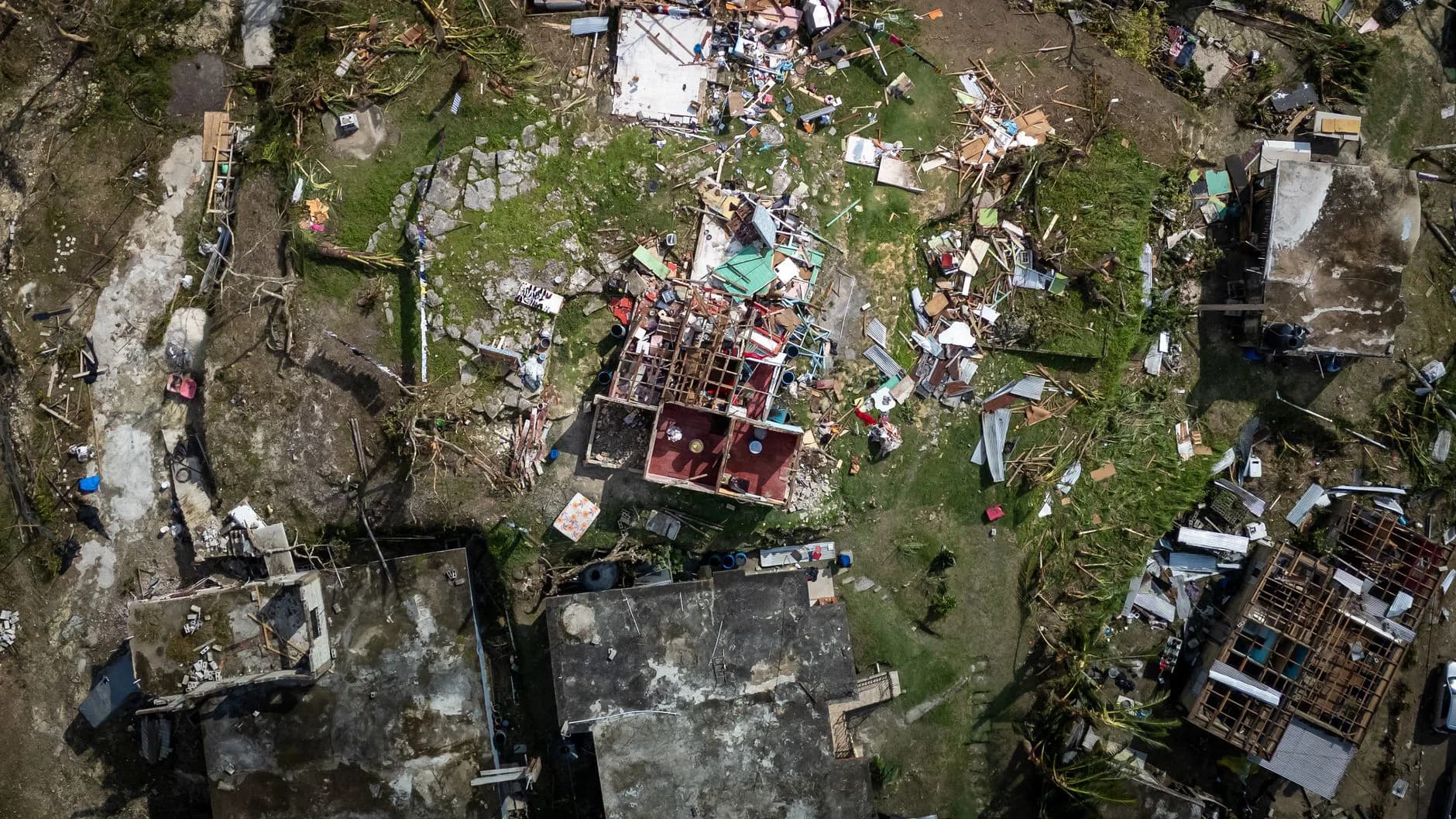 A tarp covering storm damage on a roof