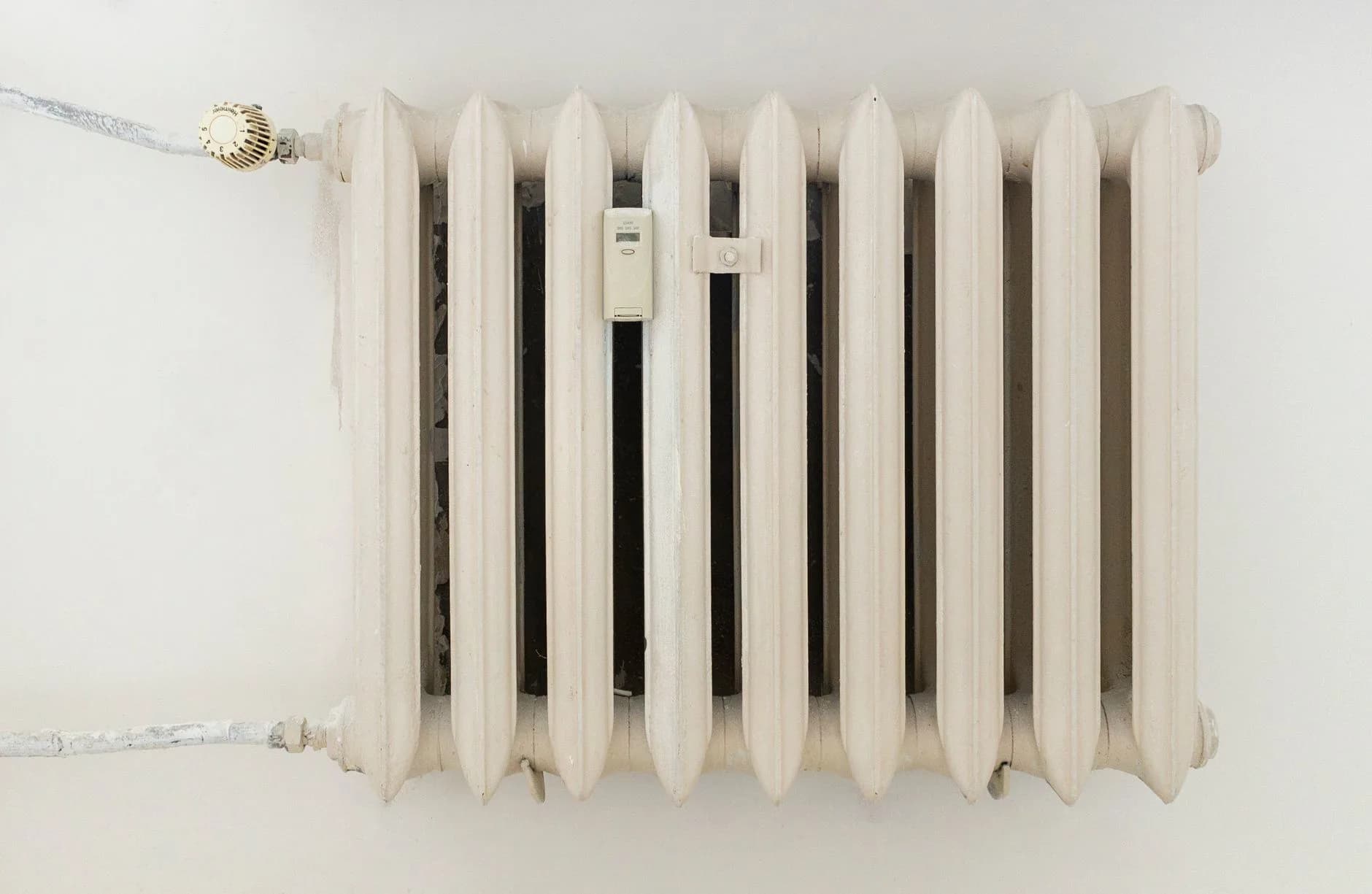A radiator on a wall in a renovated room