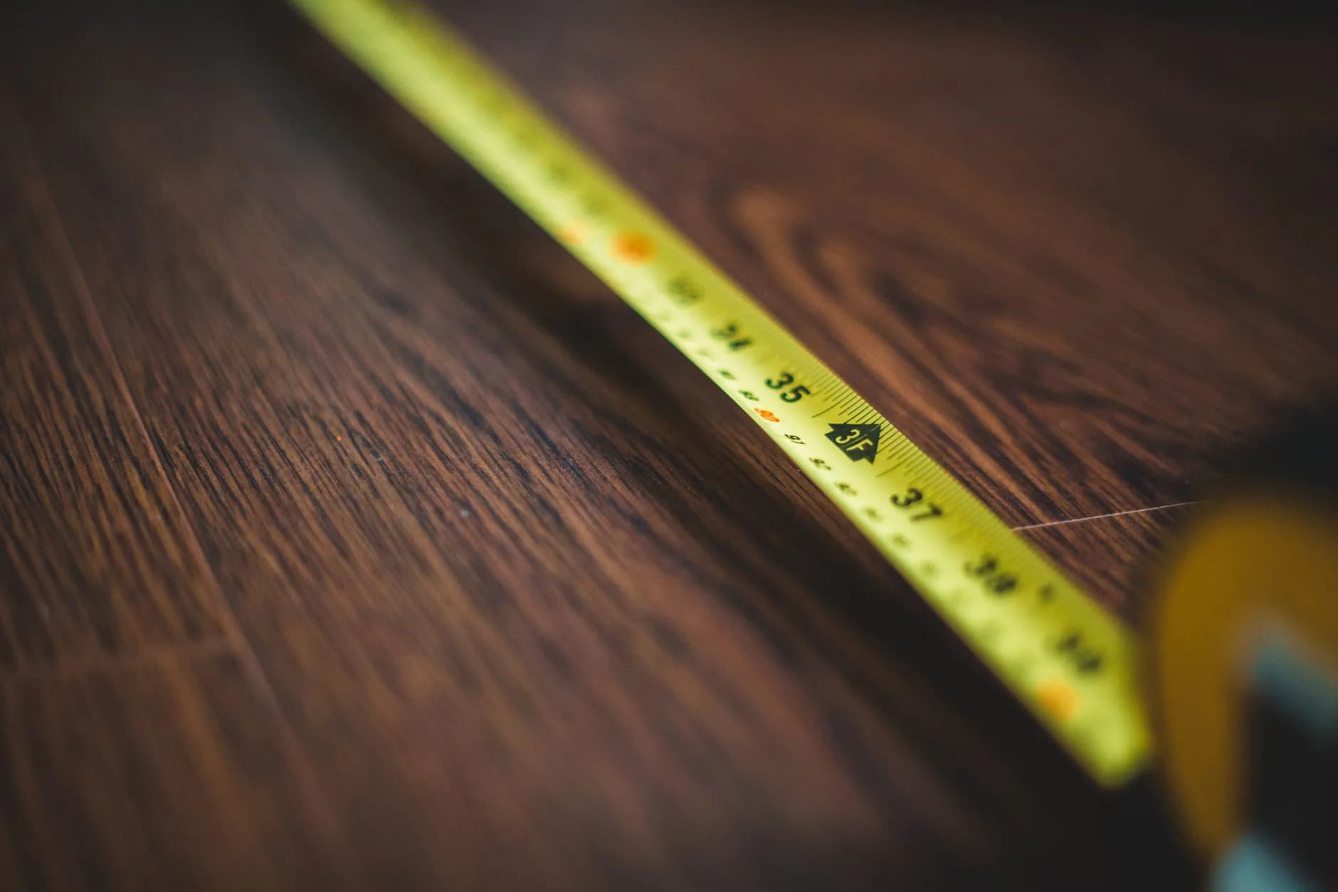 A measurement being taken on a floor