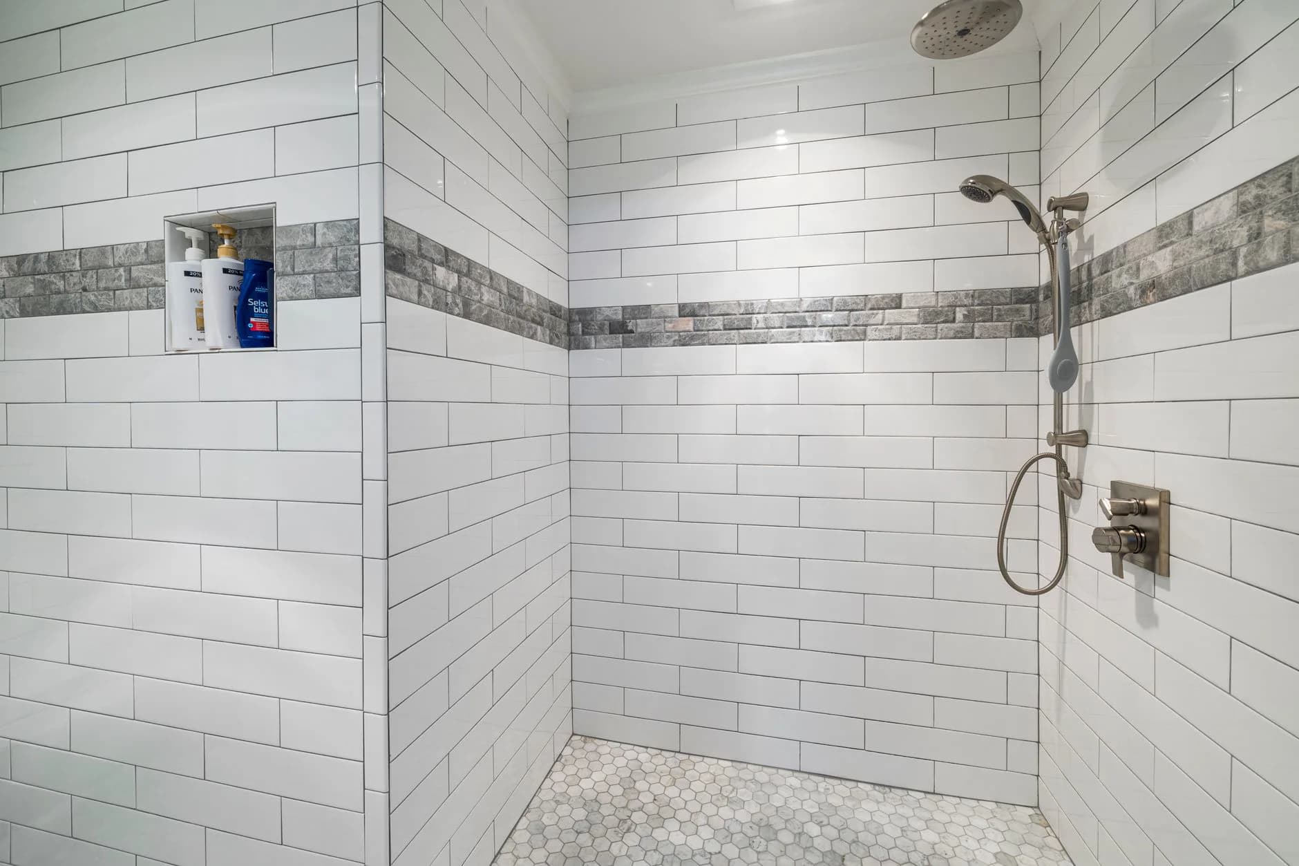 Tiling work on a bathroom wall