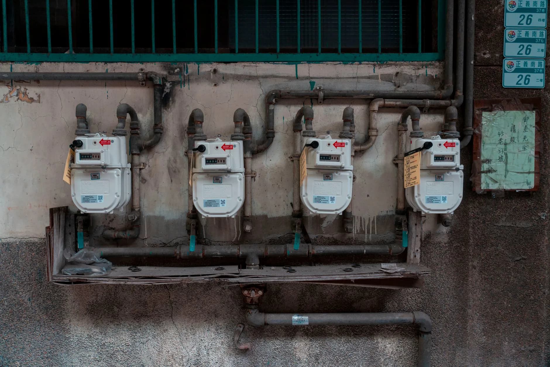 A gas meter on an exterior wall