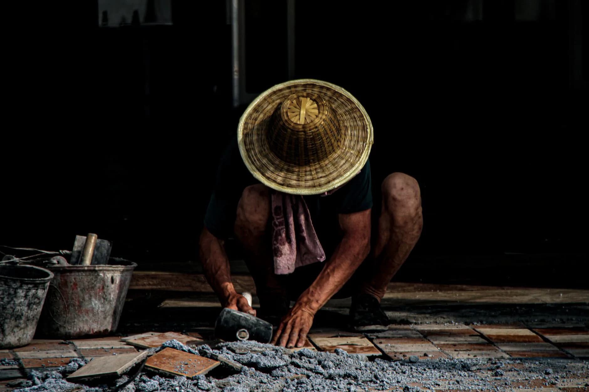 Tile being cut and set