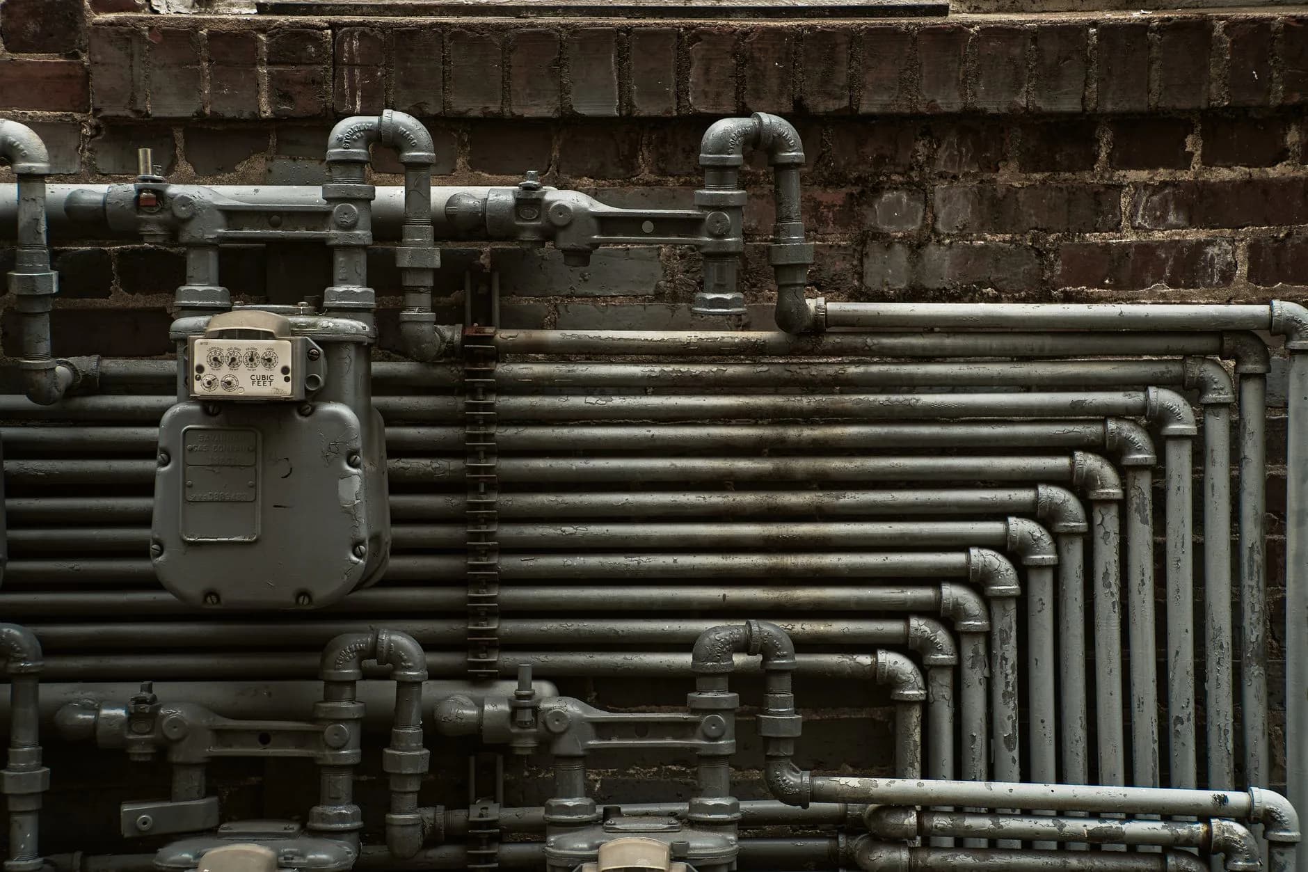 Supply and waste pipes at a wall