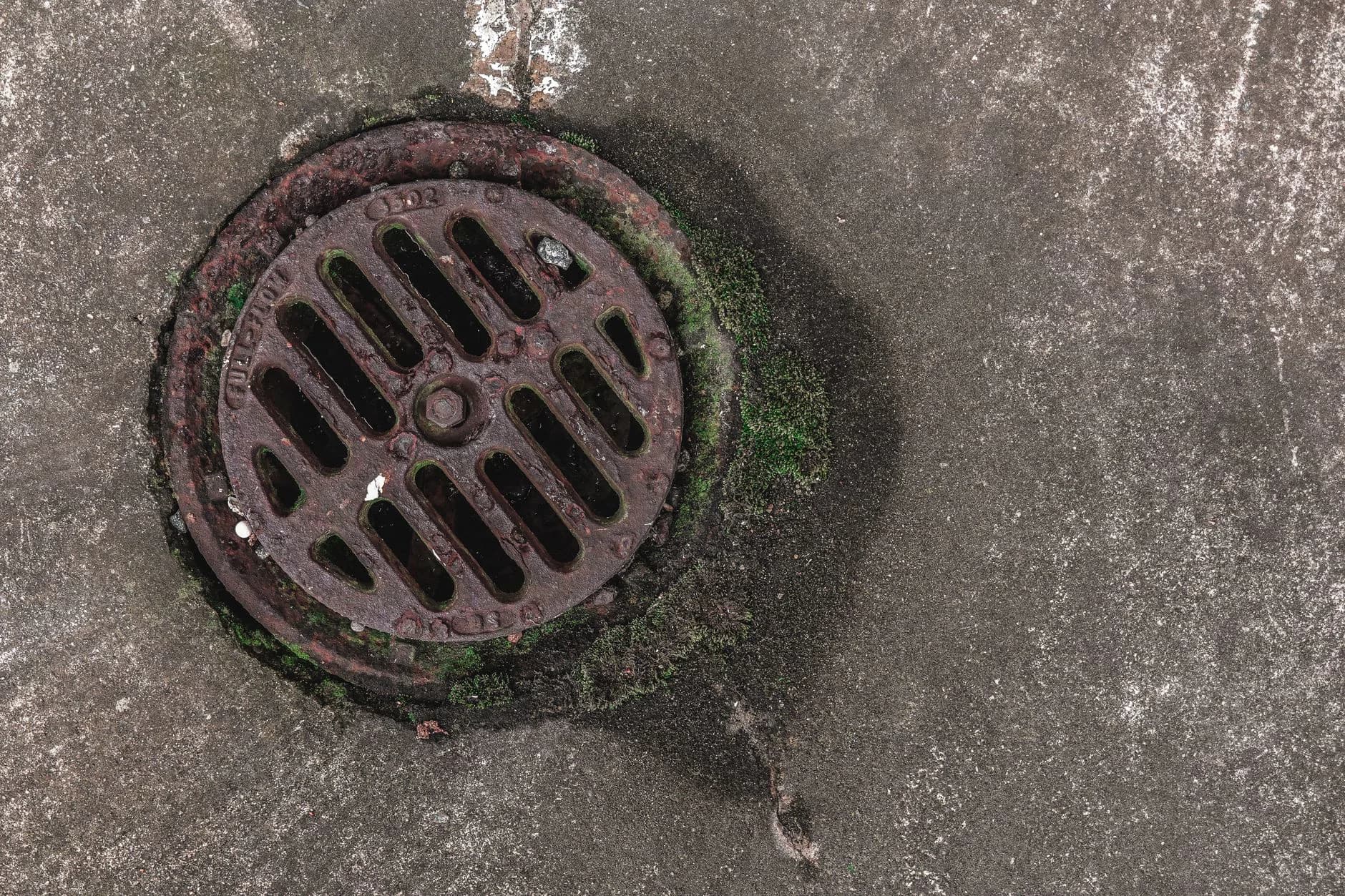 A metal grate over a drain