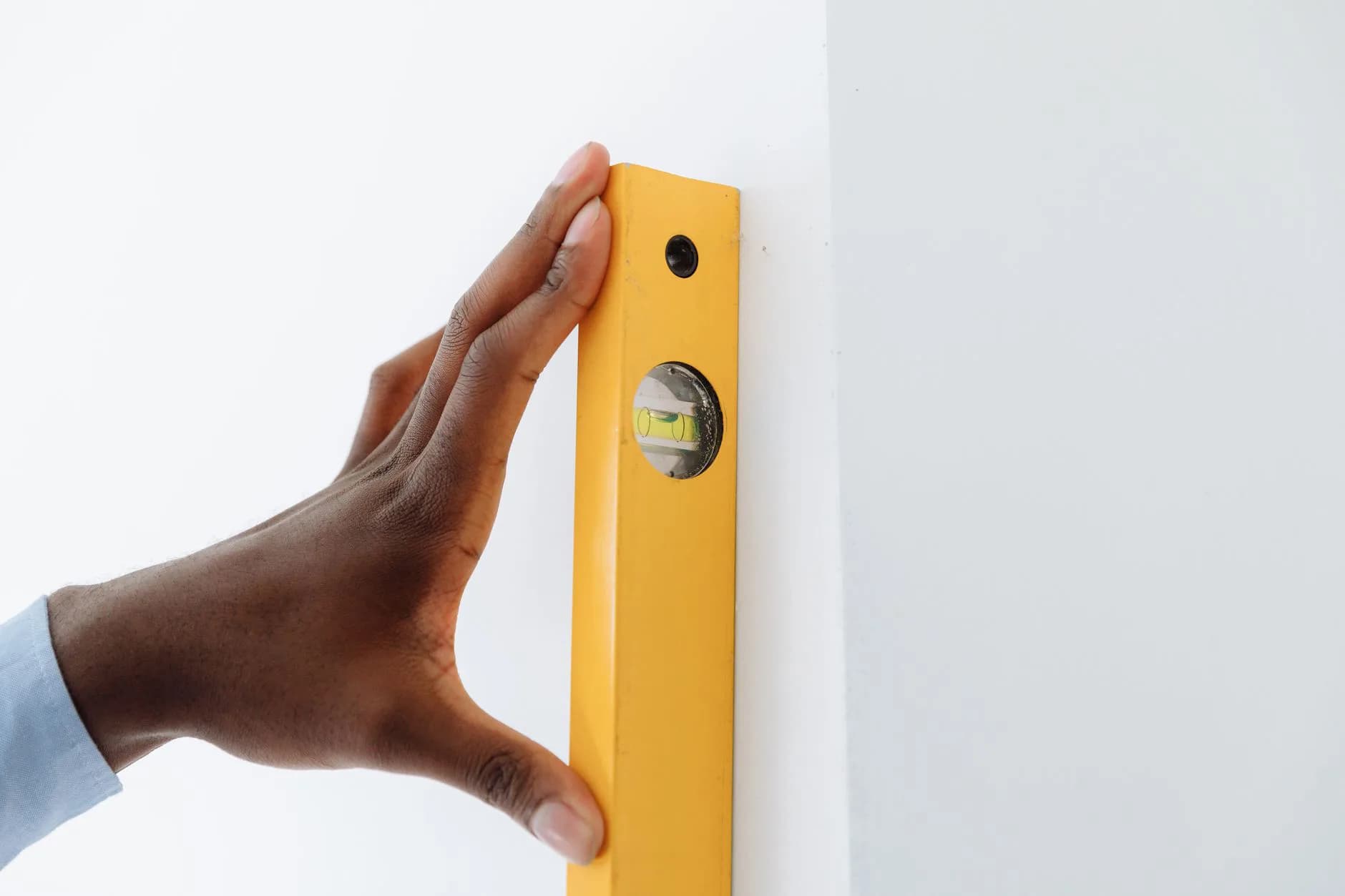 A plumb line against a wall