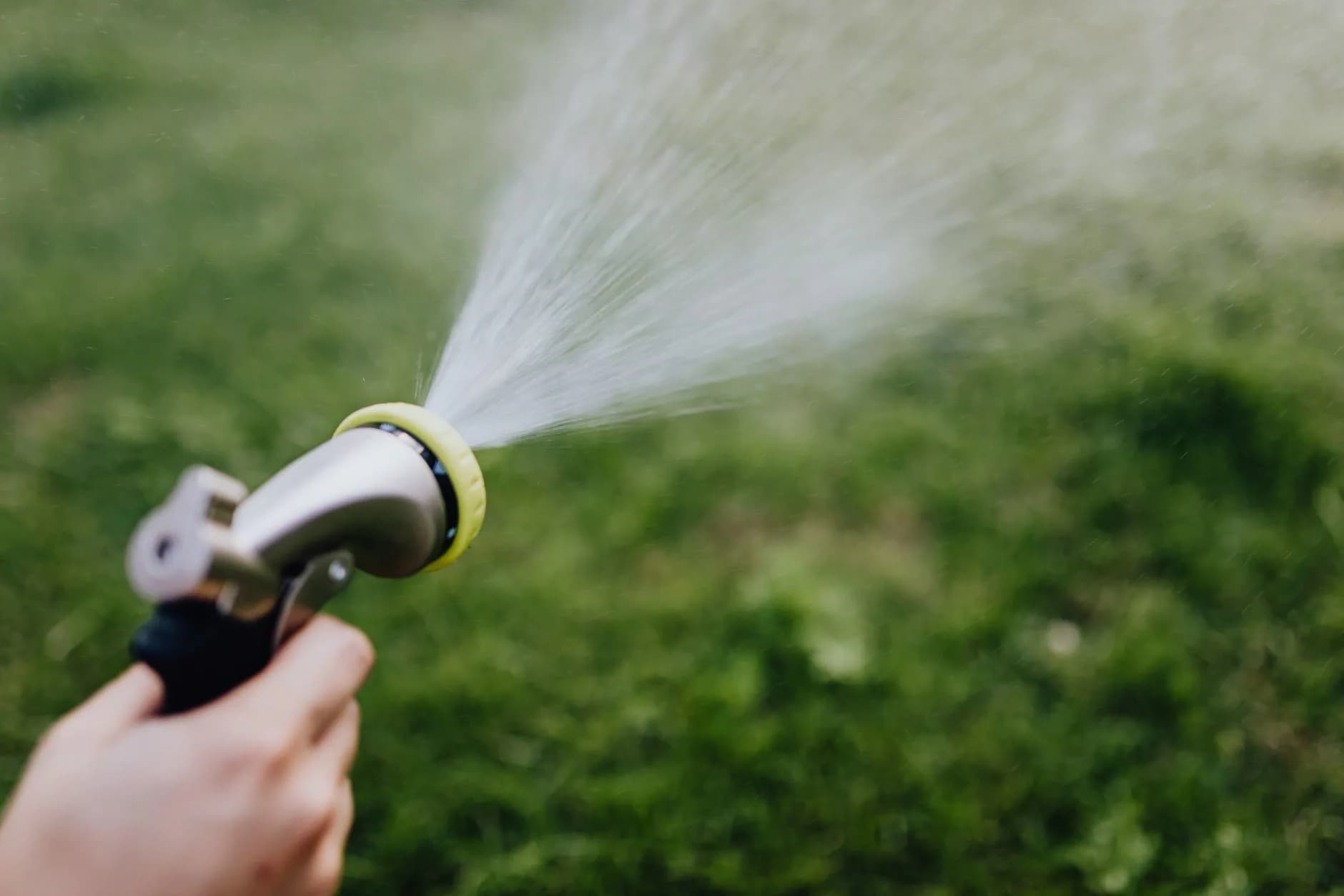 A lawn treatment being sprayed