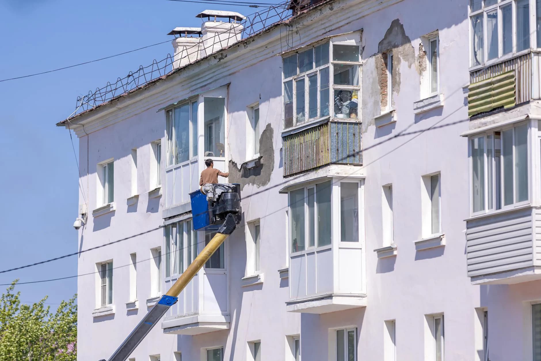 Scaffolding set up along the side of a house for exterior painting